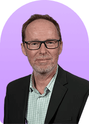 Headshot of a man in a suit against a purple background