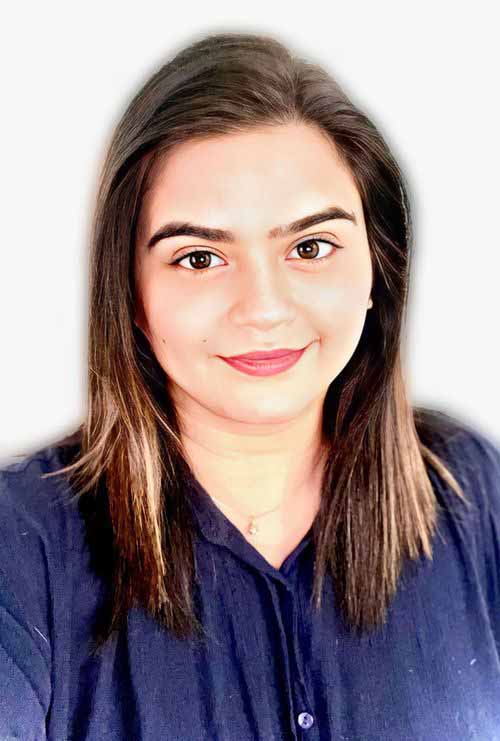 Headshot of a woman with shoulder-length brown hair wearing a dark blue shirt.